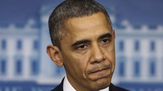 Photo of Barak H. Obama with an unhappy look on his face