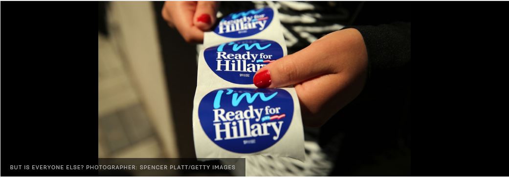 PHOTO OD A ROLL OF CAMPAIGN STICKERS PRINTED WITH THE SLOGAN "I'M READY FOR HILLARY BEING HELD IN THE HANDS OF A LADY